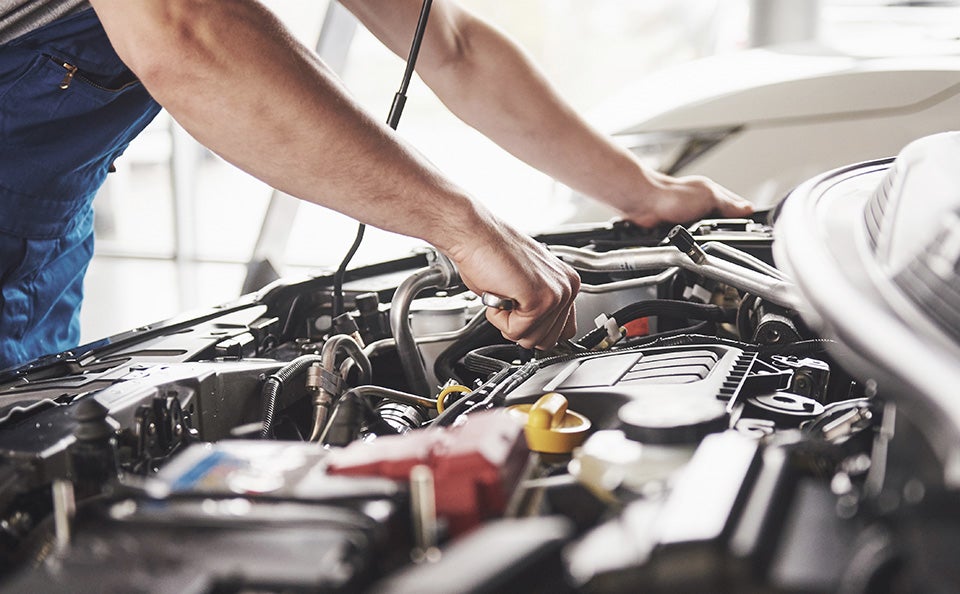 Mechanic servicing a car